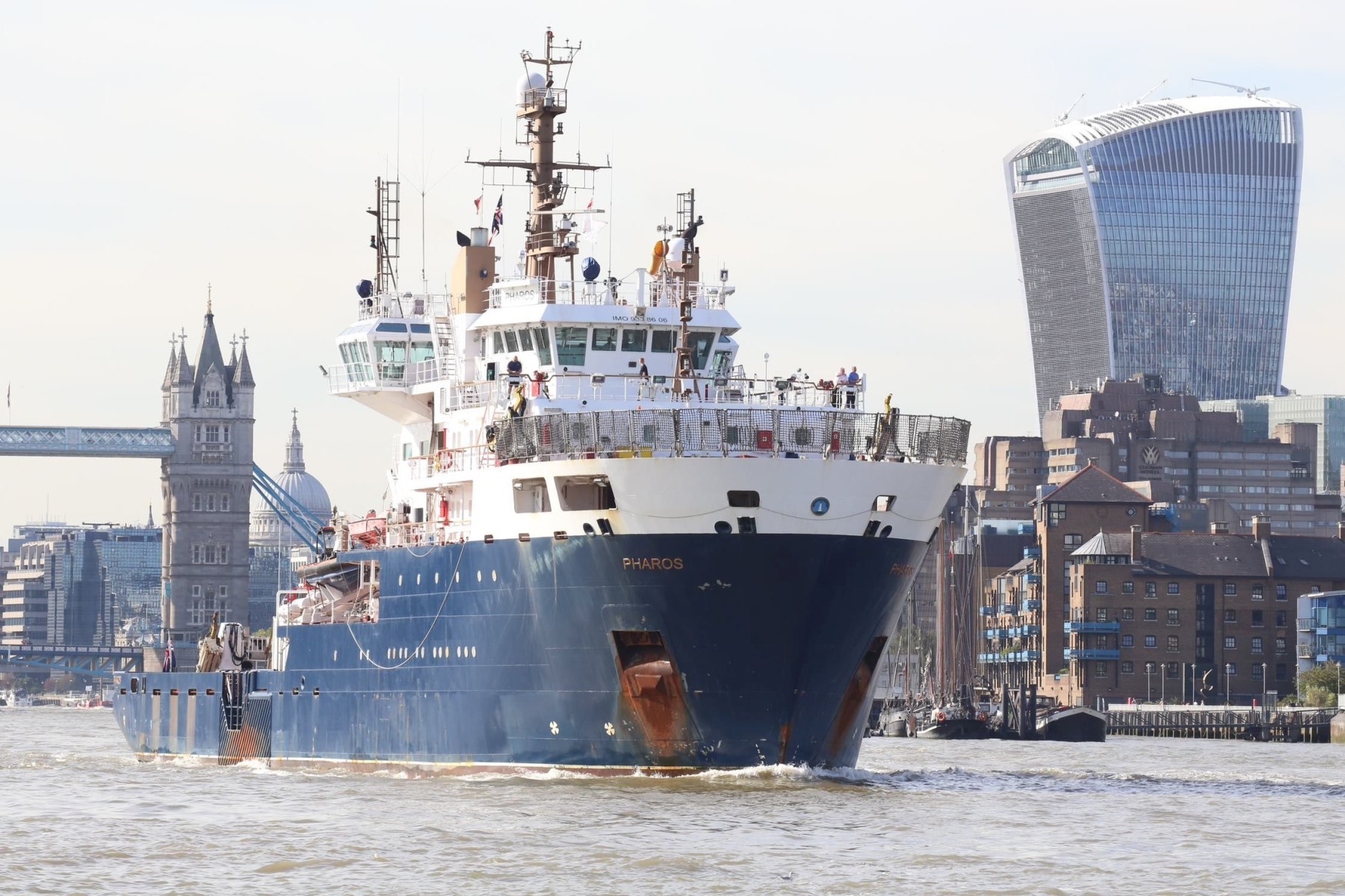 Ship NLV Pharos visiting River Thames, London 14-Sep-2019. Tower Bridge and City of London in the background.