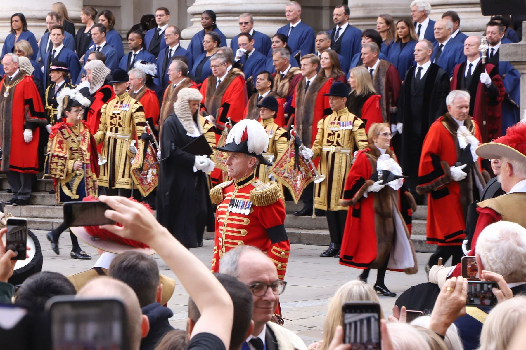 Crowds watch the Lord Mayor and dignitaries at the reading of the Royal Proclamation of King Charles III as King, read from the steps of the Royal Exchange in the City of London.