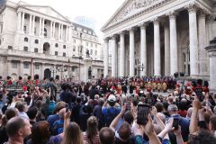 Crowds watch the Lord Mayor and dignitaries at the reading of the Royal Proclamation of King Charles III as King, read from the steps of the Royal Exchange in the City of London.