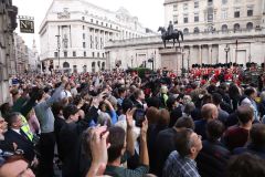 Crowds watch the Lord Mayor and dignitaries at the reading of the Royal Proclamation of King Charles III as King, read from the steps of the Royal Exchange in the City of London.