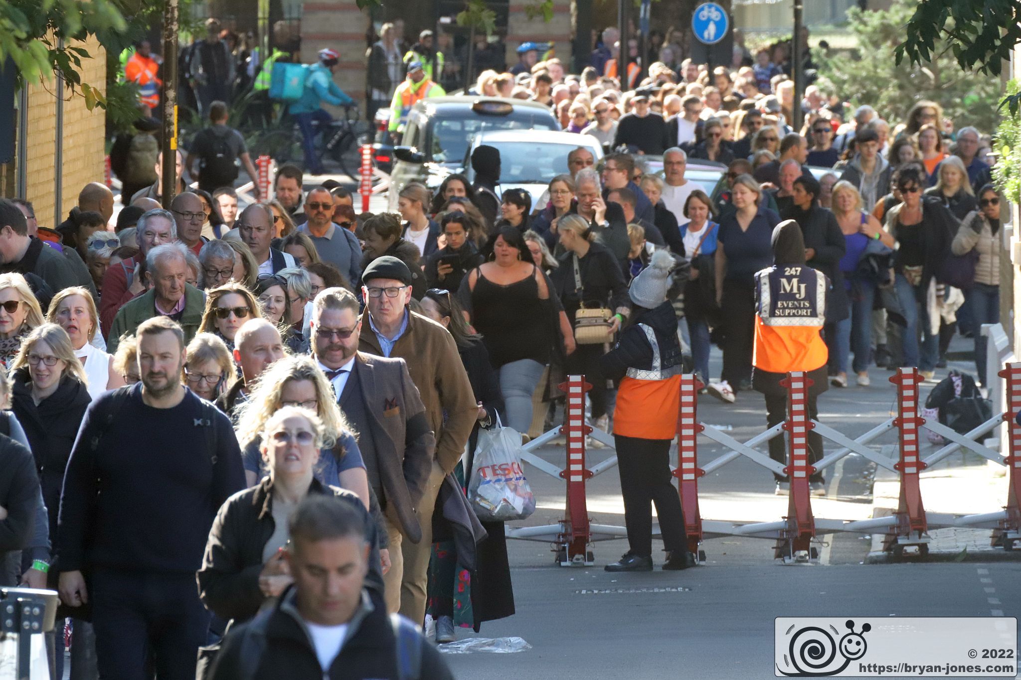 The queue seen in Cathay Street looking South from the Angel pub