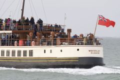 The stern of Paddle Steamer Waverley in the Thames estuary at speed with the Red Ensign flying