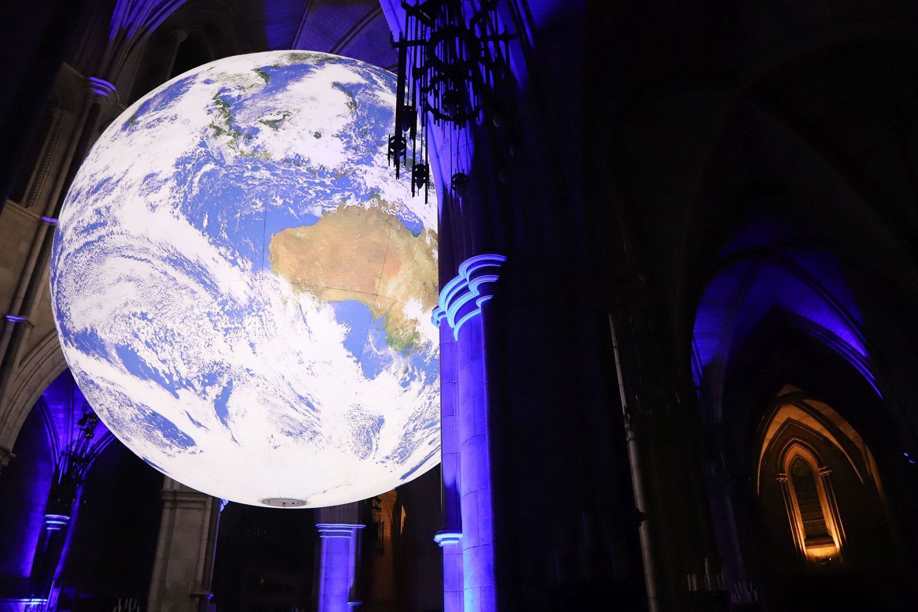 Gaia Earth by Luke Jerram at Southwark Cathedral in October 2022, seen at night