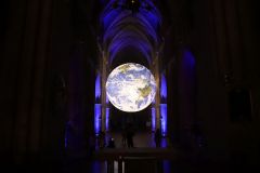 Gaia Earth by Luke Jerram at Southwark Cathedral in October 2022, seen at night