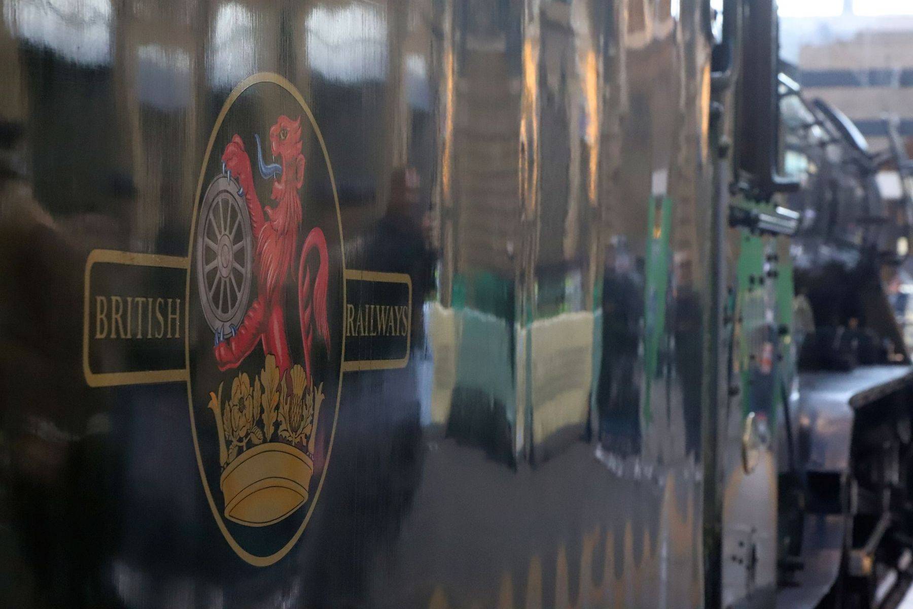 The British Railways lion and wheel badge logo on the tender of steam engine Flying Scotsman. Flying Scotsman steam locomotive at King's Cross railway station platform 8 for the 170th anniversary of the station's opening and the start of Flying Scotsman's 100th birthday celebrations