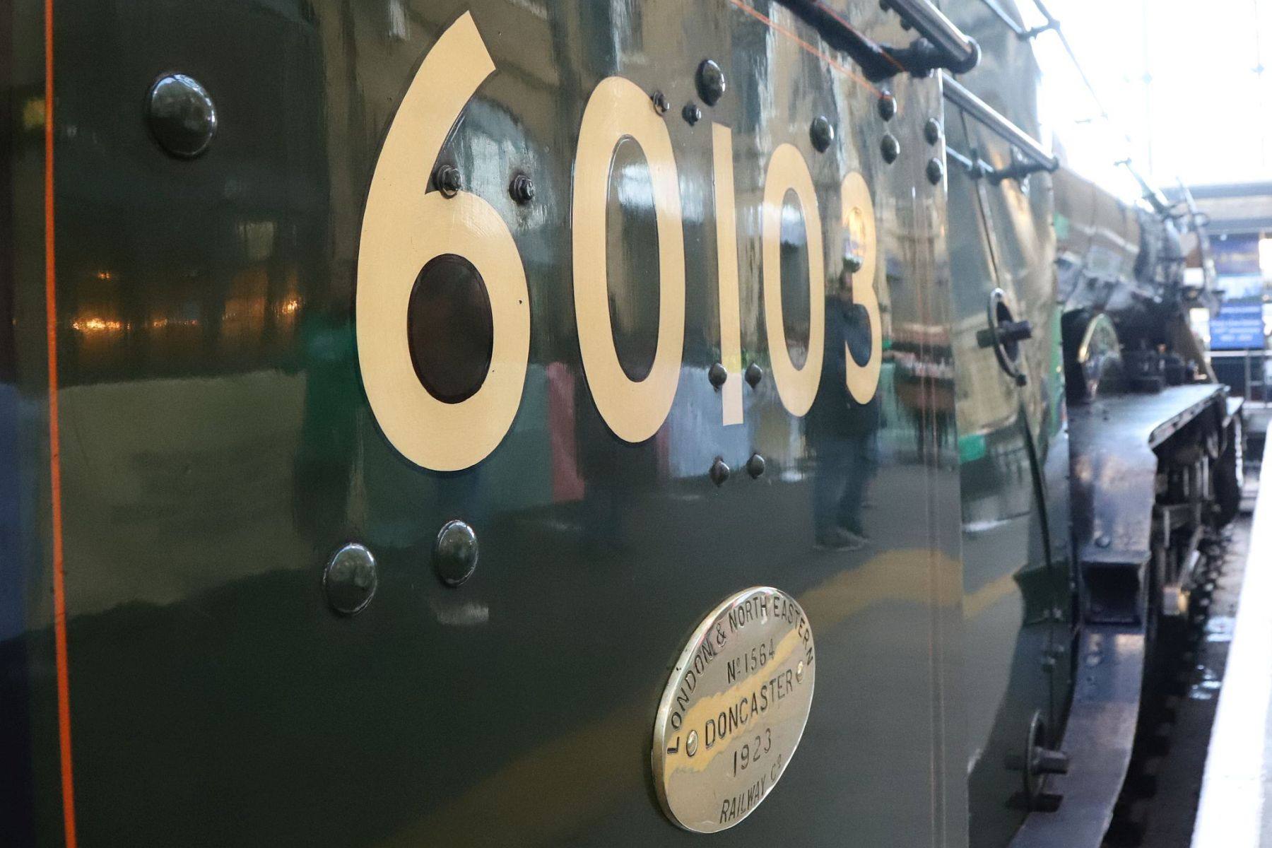 The British Railways locomotive number 60103 on Flying Scotsman's cab side . Flying Scotsman steam locomotive at King's Cross railway station platform 8 for the 170th anniversary of the station's opening and the start of Flying Scotsman's 100th birthday celebrations