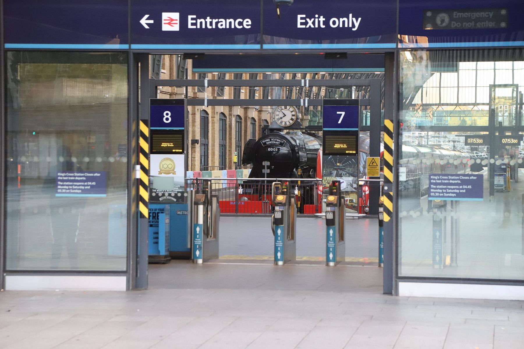Flying Scotsman seen from outside of the passenger entrance to King's Cross railway station. Flying Scotsman steam locomotive at King's Cross railway station platform 8 for the 170th anniversary of the station's opening and the start of Flying Scotsman's 100th birthday celebrations