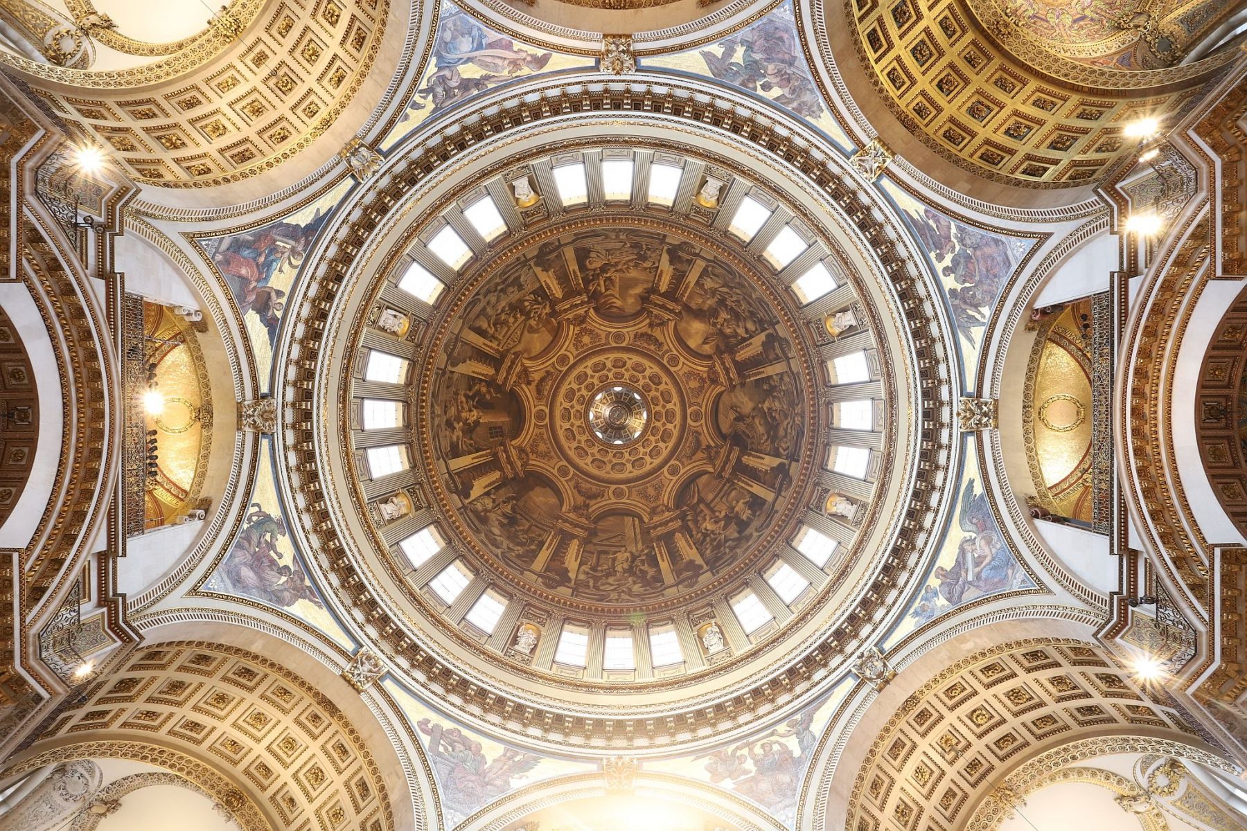 Interior of the dome and whispering gallery of St. Paul's cathedral built by Sir Christopher Wren in London.  Seen from the cathedral floor, looking straight up. 29-Oct-2022.