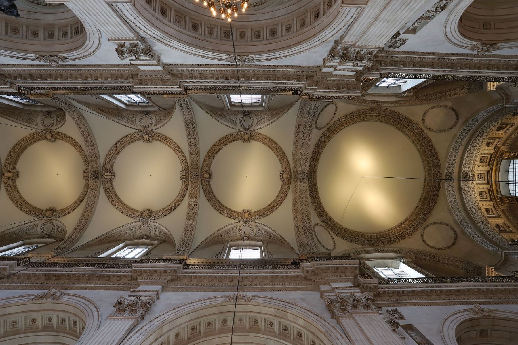 The ceiling of the nave in St. Paul's cathedral built by Sir Christopher Wren in London.  Seen from the cathedral floor, looking straight up. 29-Oct-2022.
