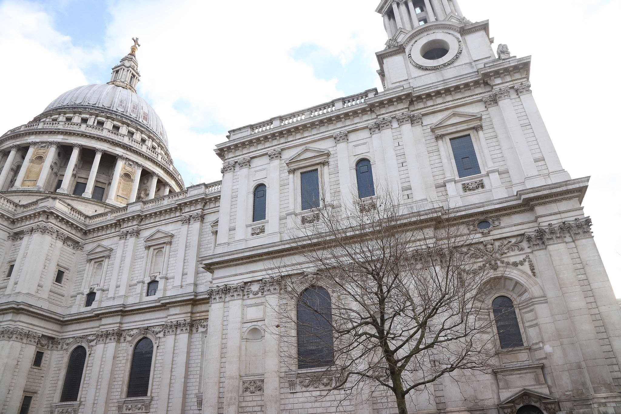 The North Wall of St. Paul's cathedral seen from the ground by the entrance showing the windows on the first floor of the room containing the Great Model. 2023.