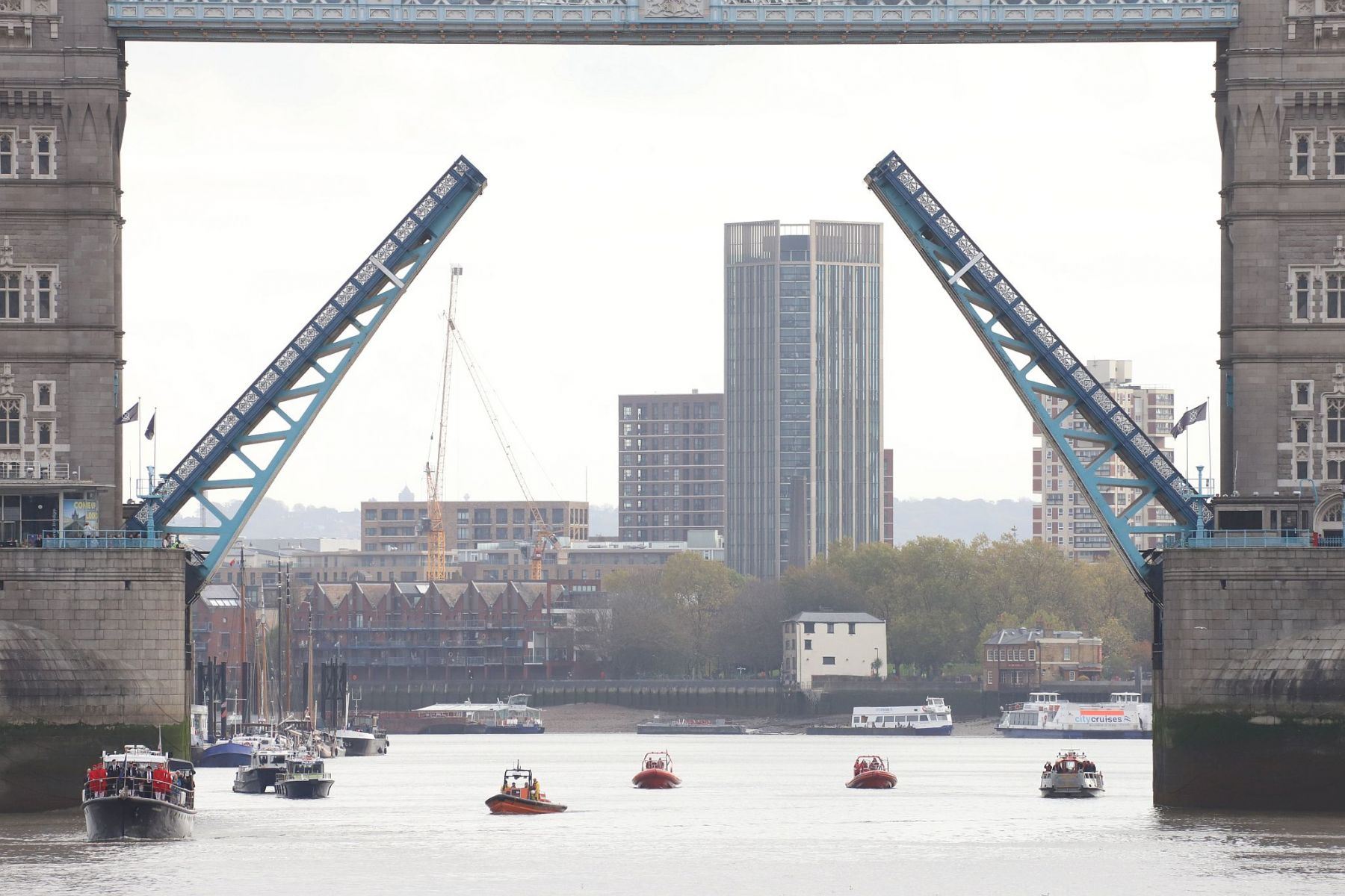2022 River Thames Armistice Day flotilla passing through Tower Bridge