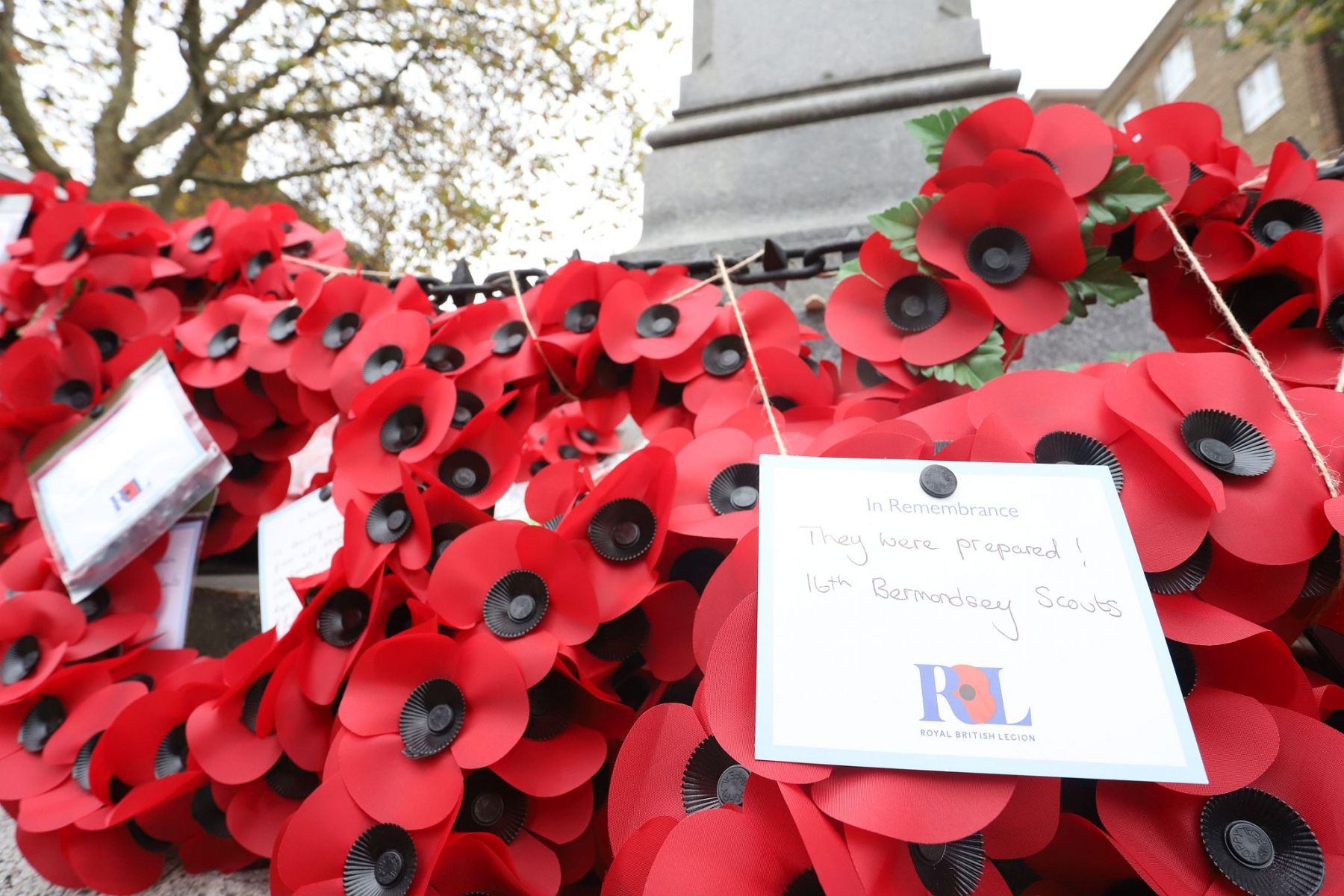 Wreathes of poppies on the Bermondsey West Lane War Memorial, Remembrance Sunday 2022