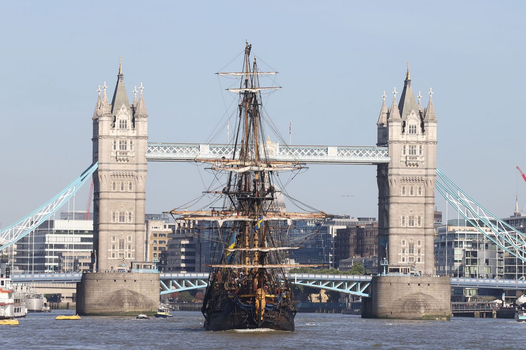 Sailing ship Götheborg of Sweden framed by Tower Bridge, sailing  downstream through London on the River Thames
