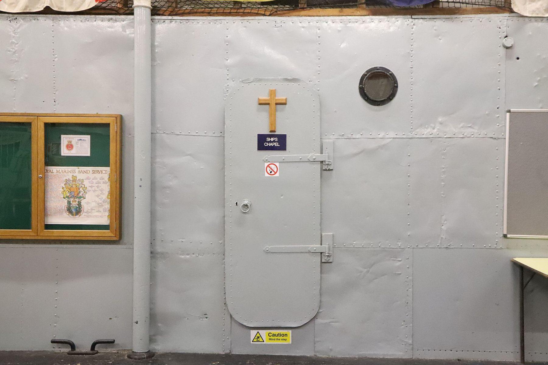Watertight door to Ship's Chapel. Interior of the Kilburn Tin Tabernacle church (Cambridge Avenue, London) fitted out as a Royal Navy Ton Class ship by Sea Cadets of TS Bicester