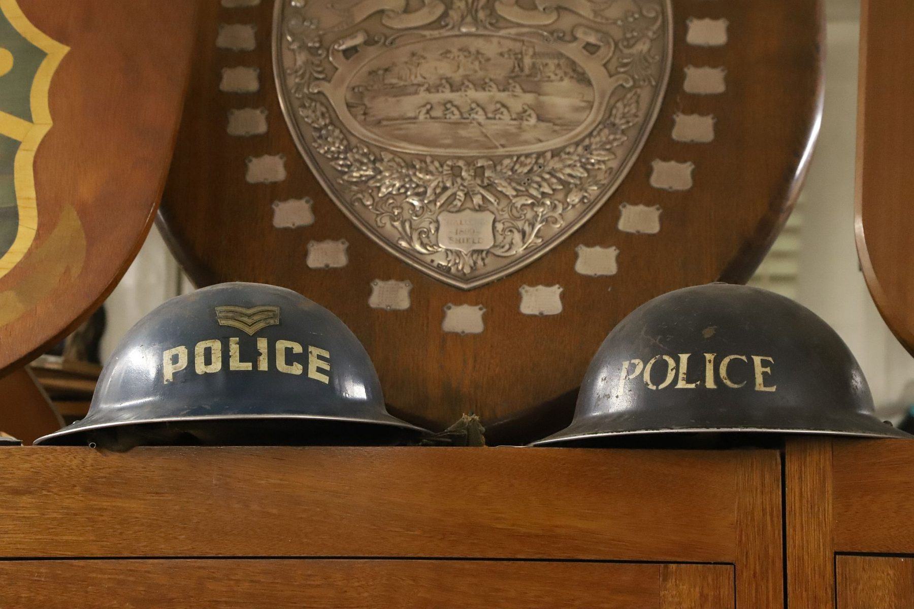 Two Police helmets from World War Two. Metropolitan Police Marine Policing Unit Museum, River Thames, London.