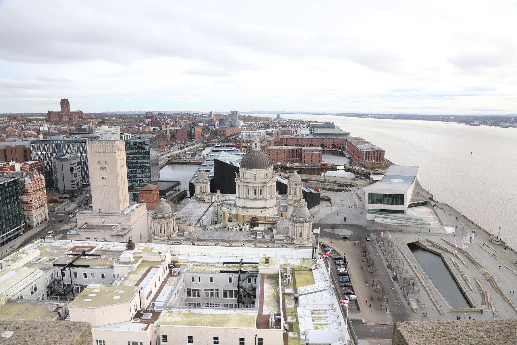 Royal Liver Building 360 Tower Tour looking down on the Liverpool waterfront and Pier Head. Liverpool Cathedral and the ventilation shaft for the Queensway Tunnel