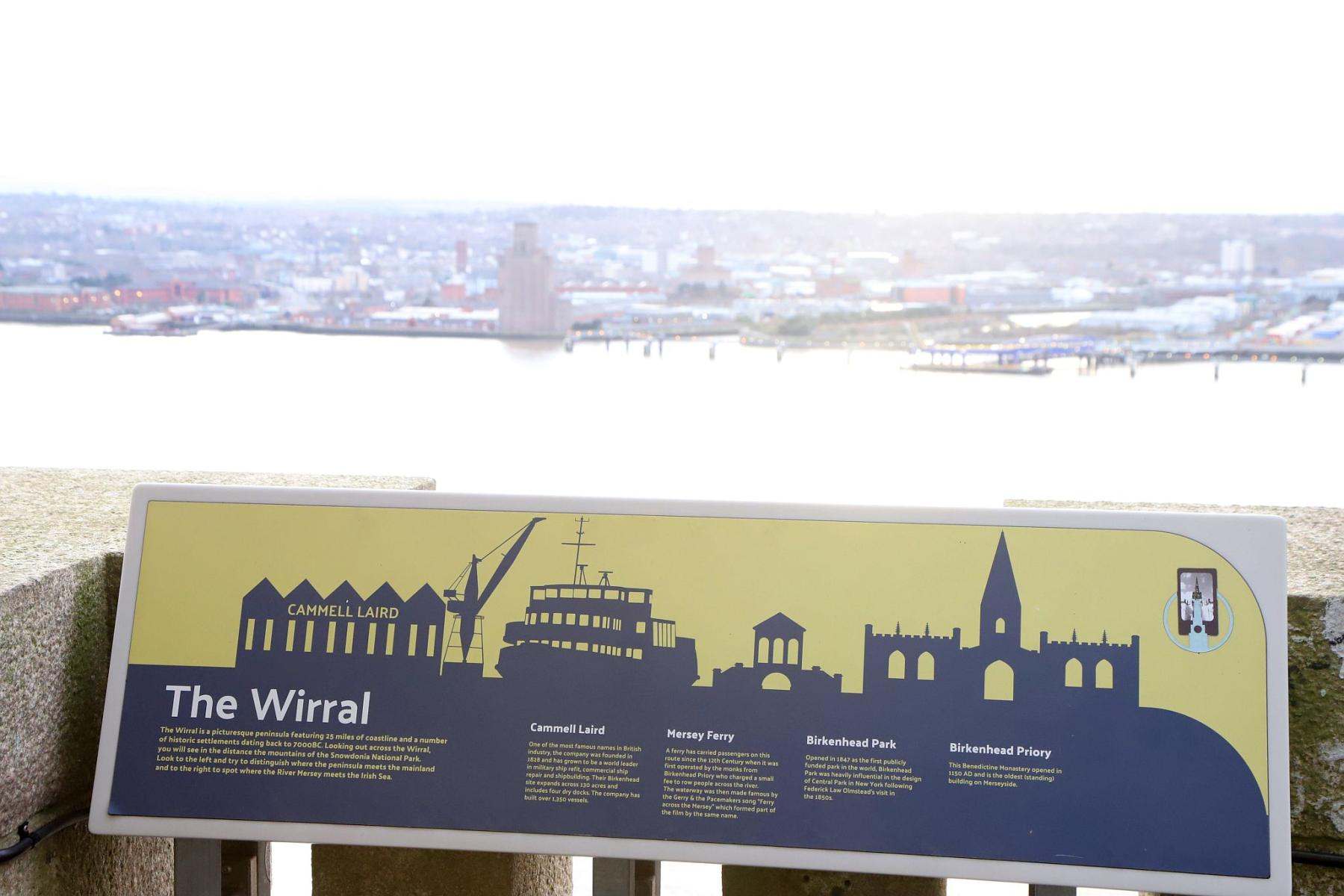 Royal Liver Building 360 Tower Tour looking from the roof to the Wirral with the information board in the foreground