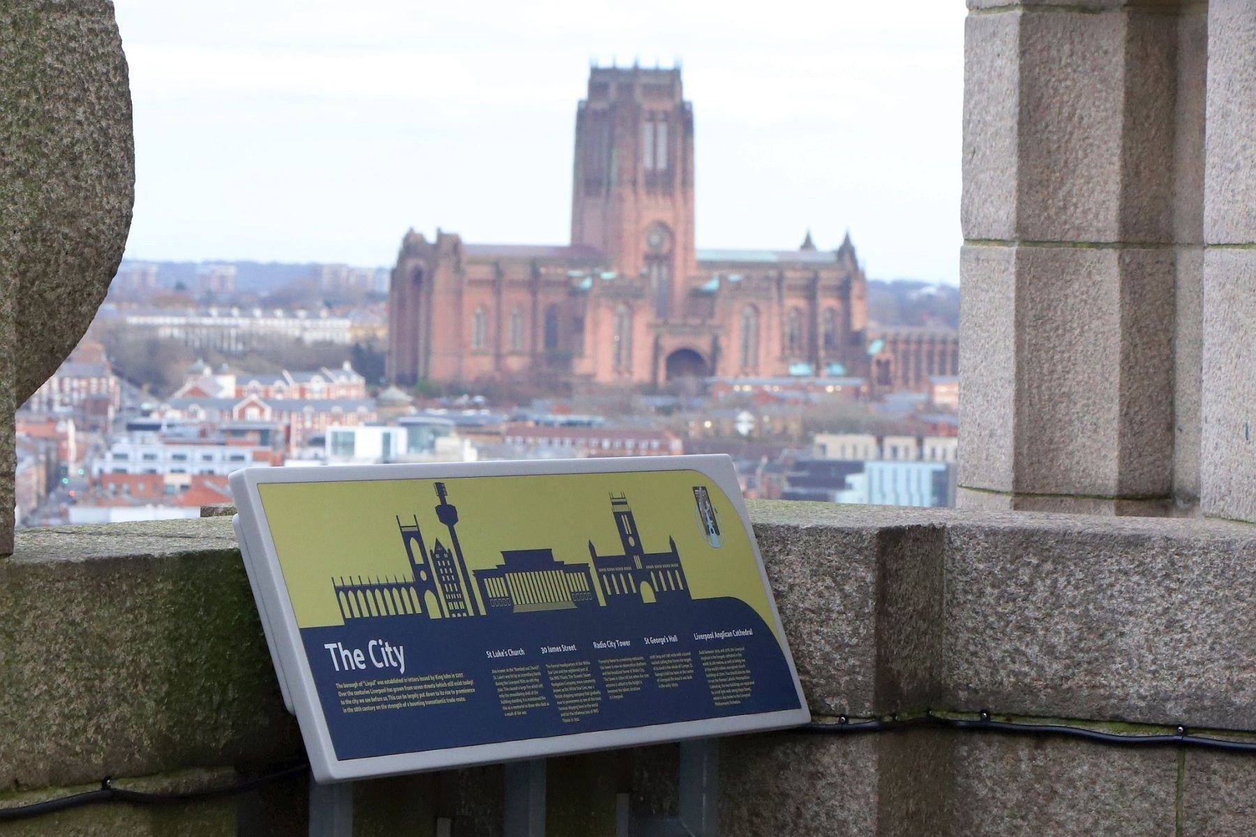 Royal Liver Building 360 Tower Tour looking across to Liverpool Cathedral with an information board in the foreground