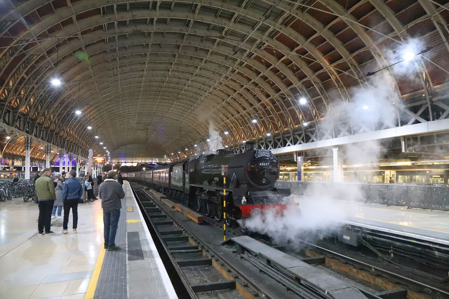 LMS Jubilee Class 5699/45699 Galatea at London Paddington railway station on the evening of 18-Feb-2023 with the Railway Touring Company's special train The Cotswold Venturer. Running as 45627 "Sierra Leone" with 45562 painted on the cab side.