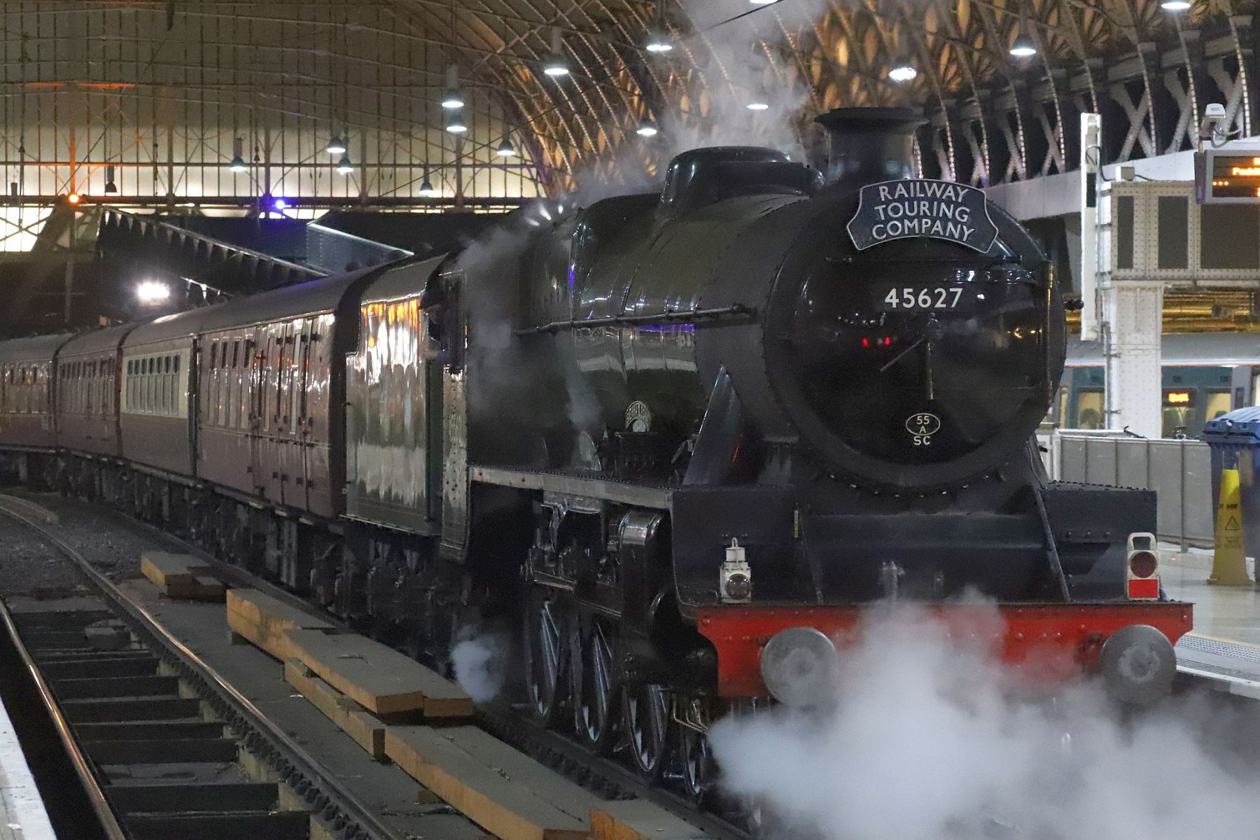 LMS Jubilee Class 5699/45699 Galatea at London Paddington railway station on the evening of 18-Feb-2023 with the Railway Touring Company's special train The Cotswold Venturer. Running as 45627 "Sierra Leone" with 45562 painted on the cab side.