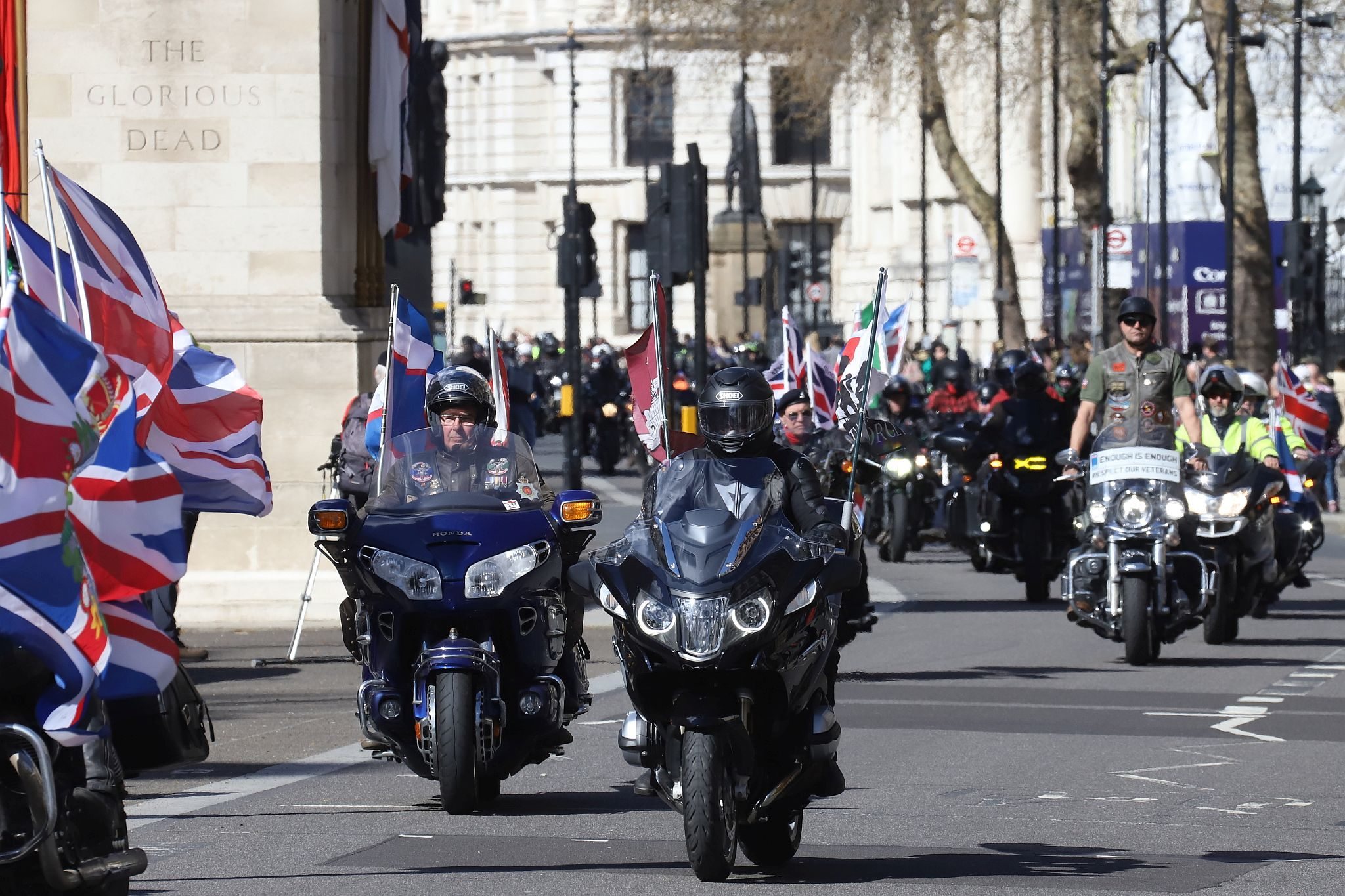 The Rolling Thunder UK military veterans motorcycle Ride of Respect, in memory of the late HM Queen Elizabeth II. 7th April 2023, Good Friday. Photographed in Whitehall, Westminster, London passing The Cenotaph war memorial and 10 Downing Street. Armed forces veterans. Union Flag. Union Jack.