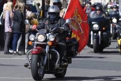 The Rolling Thunder UK military veterans motorcycle Ride of Respect, in memory of the late HM Queen Elizabeth II. 7th April 2023, Good Friday. Photographed in Whitehall, Westminster, London passing The Cenotaph war memorial and 10 Downing Street. Armed forces veterans. British Army flag.