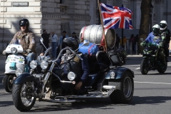 The Rolling Thunder UK military veterans motorcycle Ride of Respect, in memory of the late HM Queen Elizabeth II. 7th April 2023, Good Friday. Photographed in Whitehall, Westminster, London passing The Cenotaph war memorial and 10 Downing Street. Armed forces veterans.  Union Flag. Union Jack. Trike motorcycle.