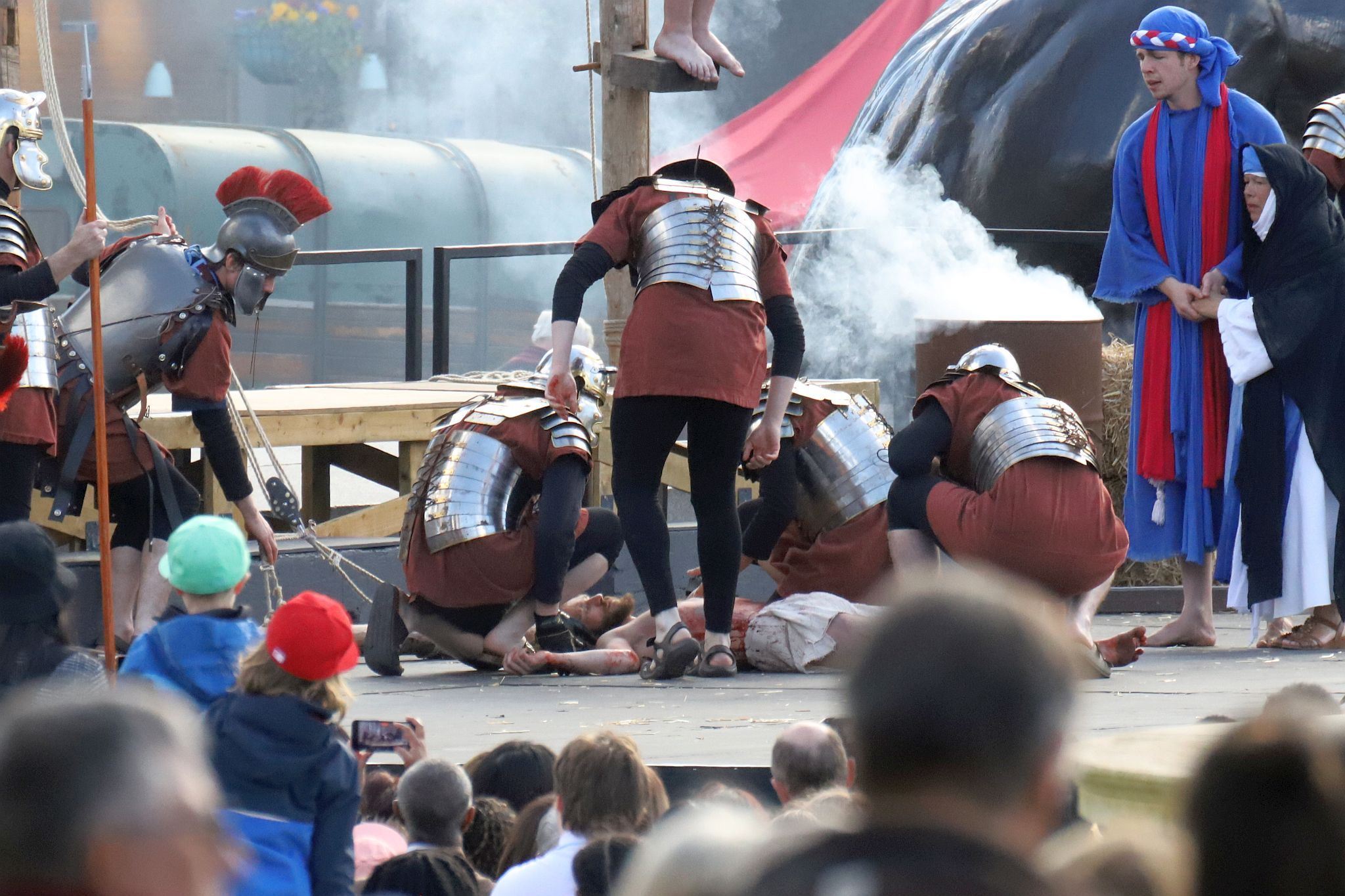 The Good Friday Wintershall Easter Passion Play "The Passion of Jesus" presented at Trafalgar Square in London. 7th April 2023. Roman soldiers take Christ's lifeless body down from the cross.