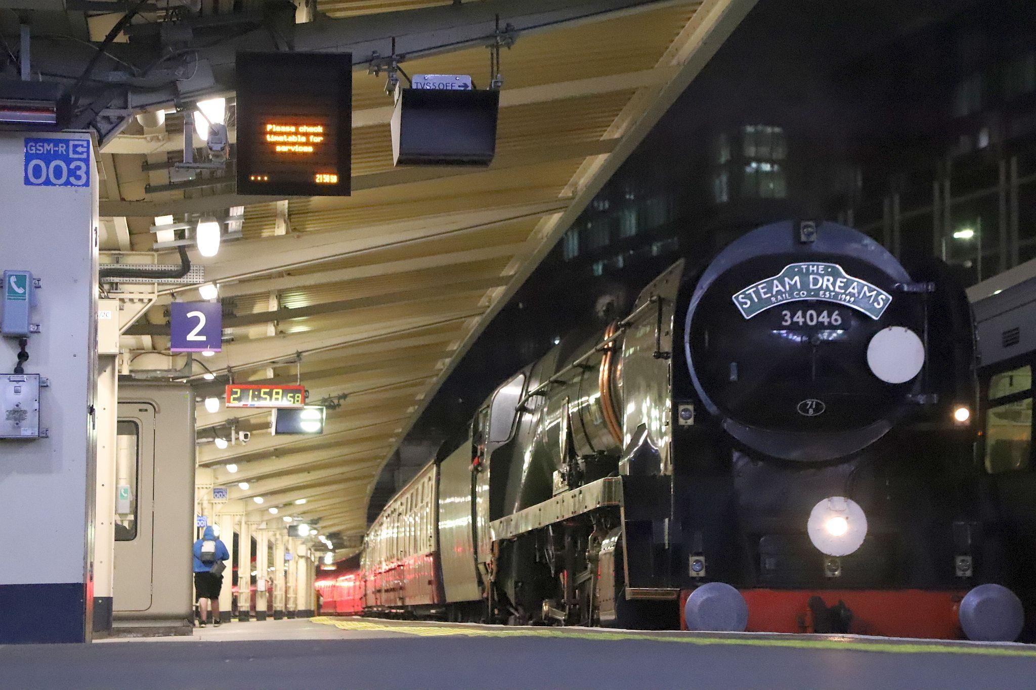 Southern Railway West Country class steam railway engine 34046 "Braunton" at platform 2 of London Victoria railway station on the night of Saturday 22nd April 2023, having worked the Steam Dreams special to Winchester and back.