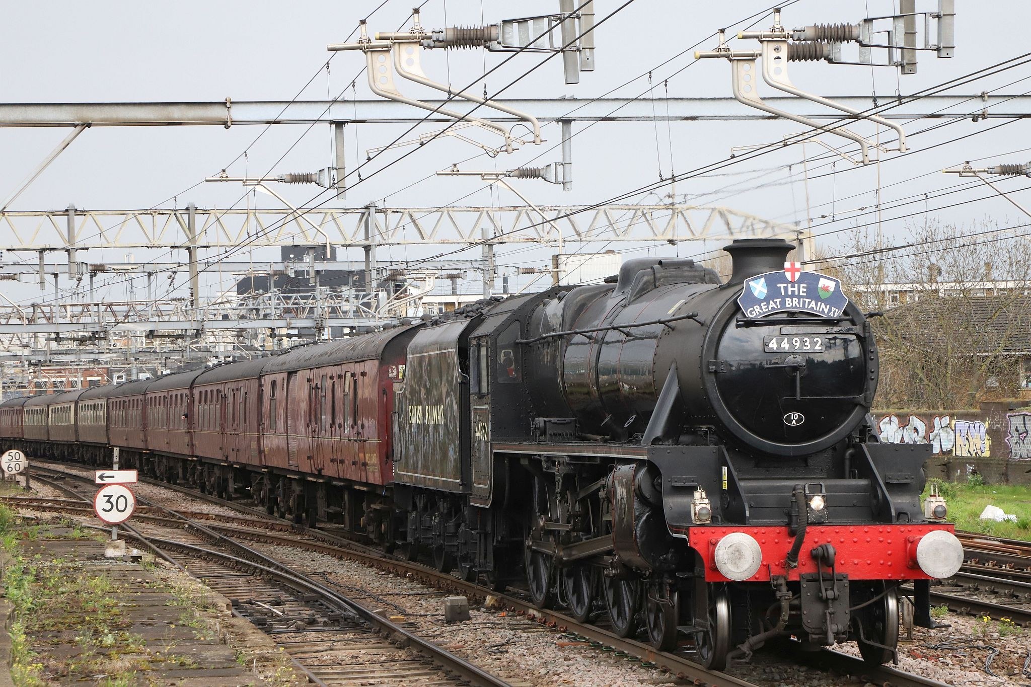 Taken at Bethnal Green railway station in London's East End. LMS Black 5 steam engine 4932 in British Rail livery carrying the BR number 44932.