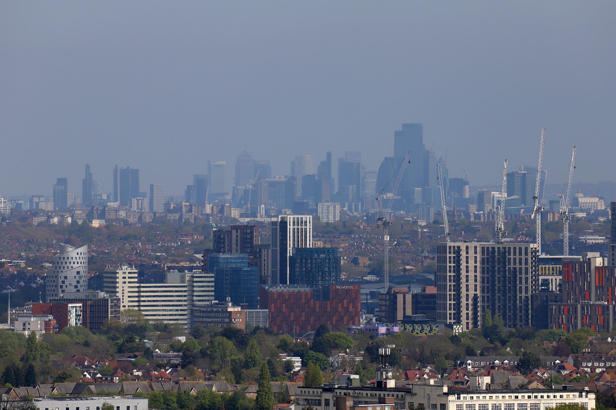 The view of the City of London and Canary Wharf seen from the tower. St Mary’s Church, Harrow-on-the-Hill, London. 29-Apr-2023.