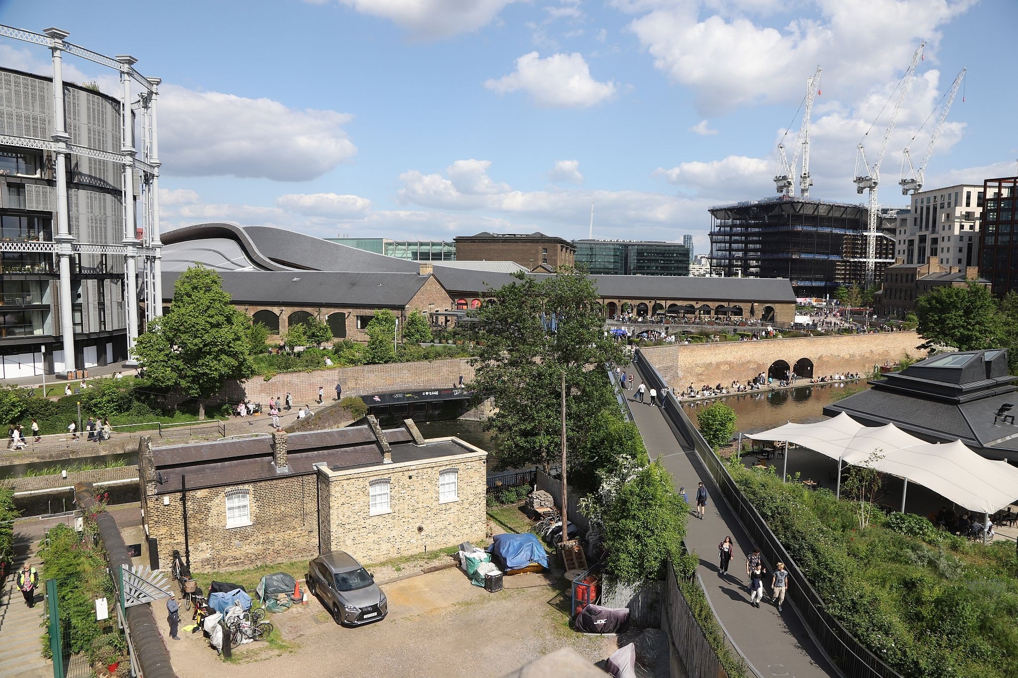The view of Coal Drops Yard looking South East from the St Pancras waterpoint. Water tower. King's Cross. Coal Drops Yard. Regents Canal. 20-May-2023.