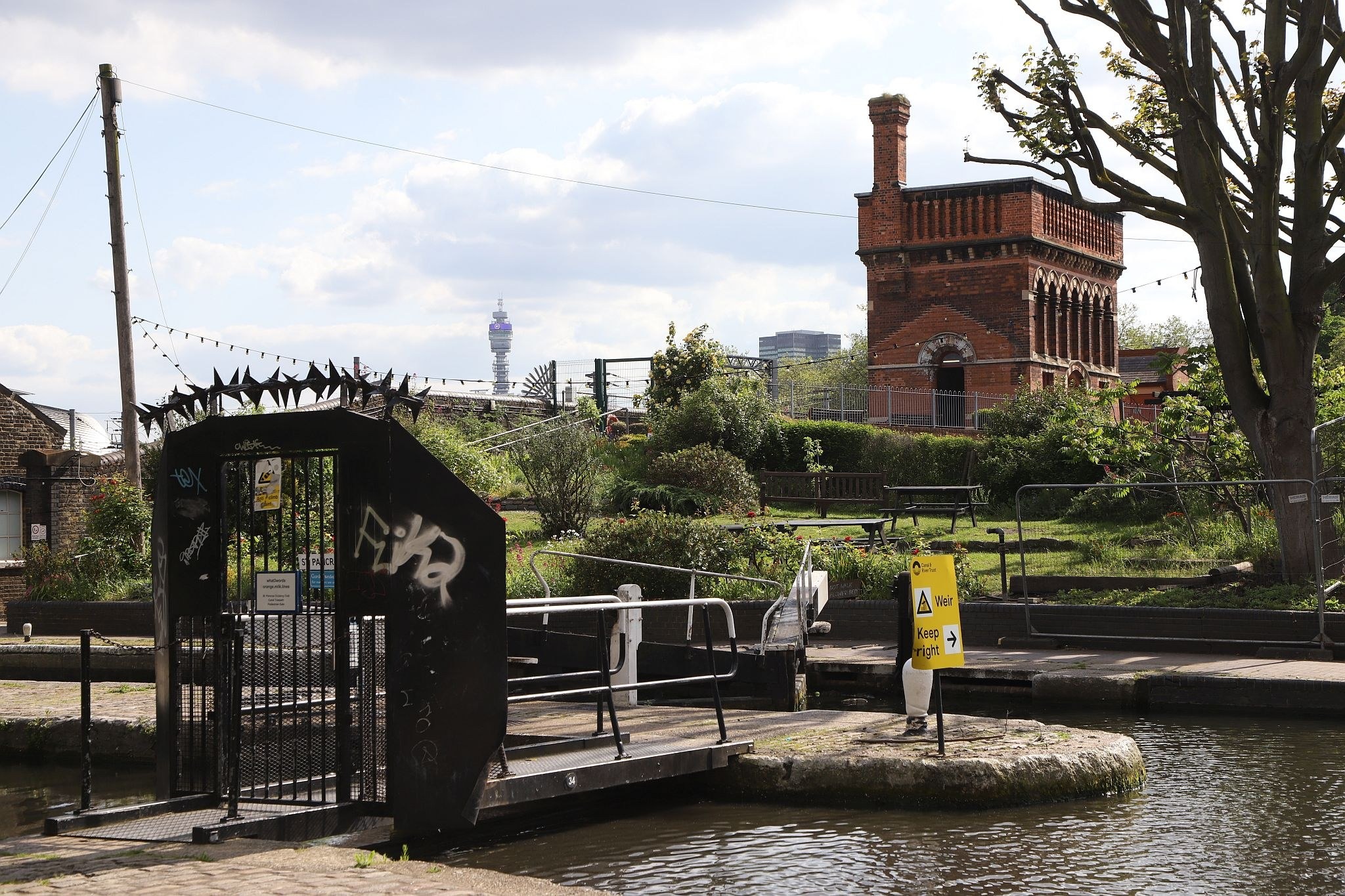 Looking  the across the Regent's Canal to the St Pancras waterpoint. Water tower. King's Cross. Coal Drops Yard. Regents Canal. 20-May-2023.