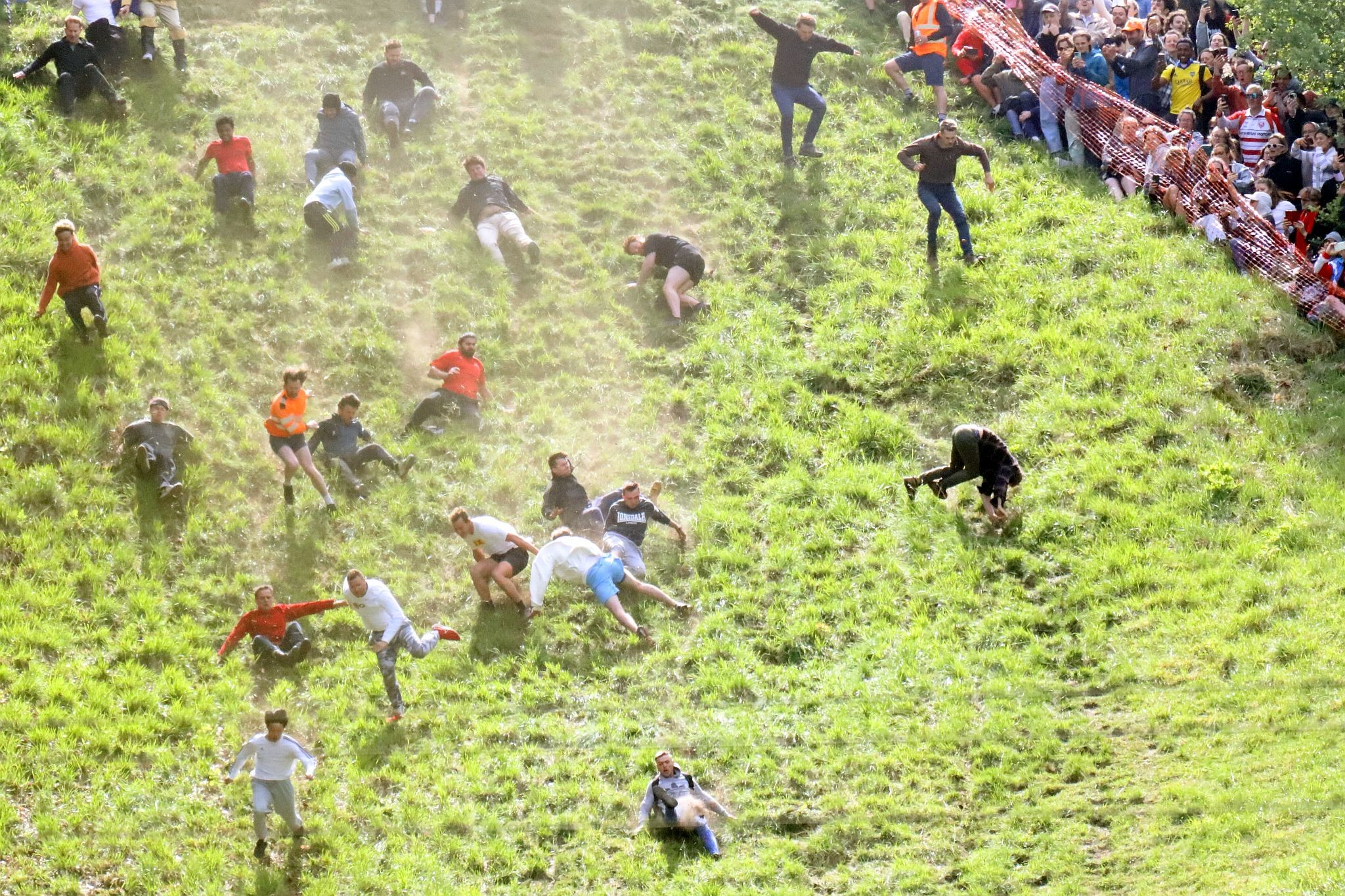 The race. Coopers Hill Cheese Rolling Race. 29-May-2023. Race downhill. Gloucestershire tradition.