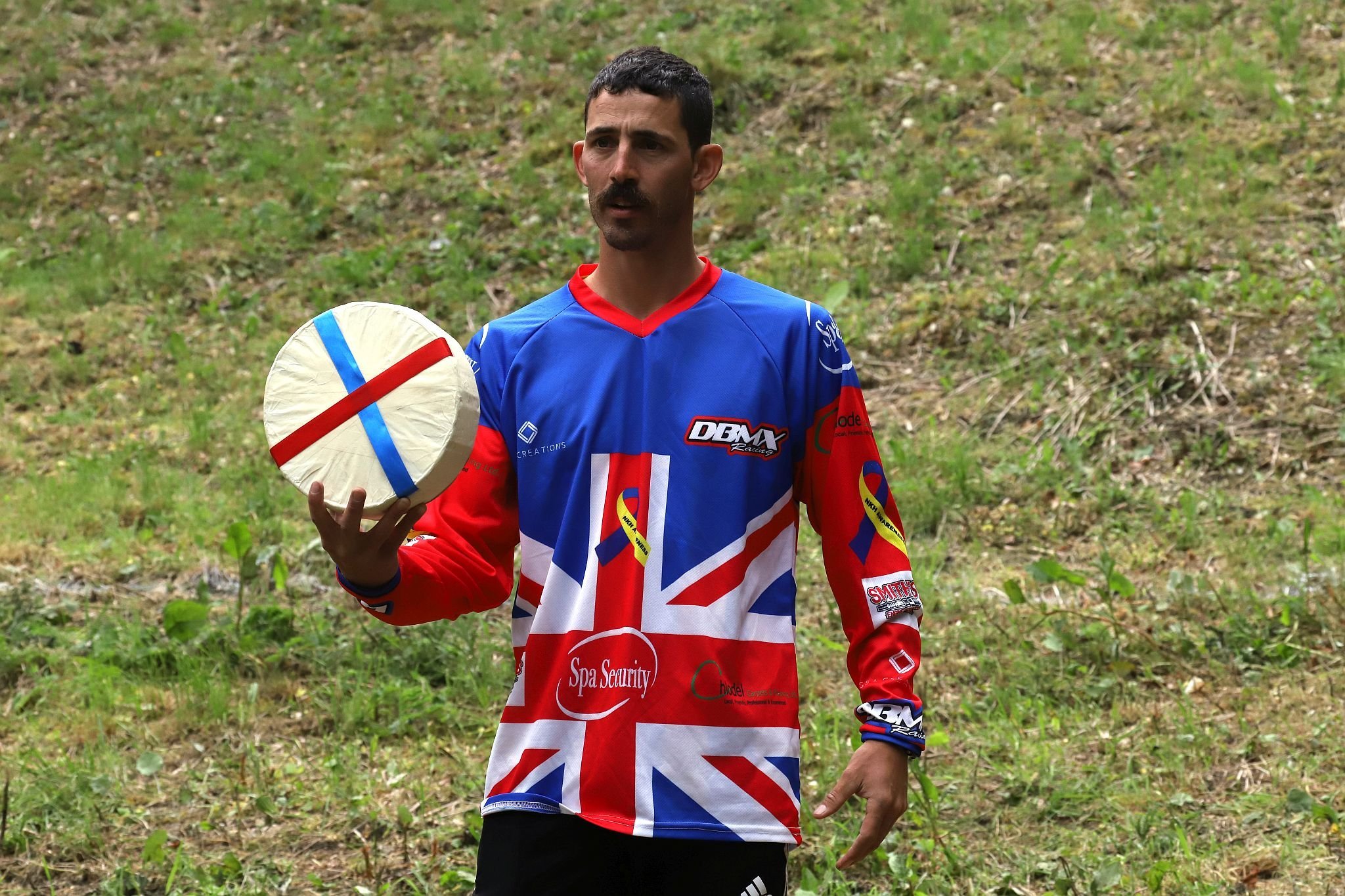 Chris Anderson, all time champion. Coopers Hill Cheese Rolling Race. 29-May-2023. Race downhill. Gloucestershire tradition.