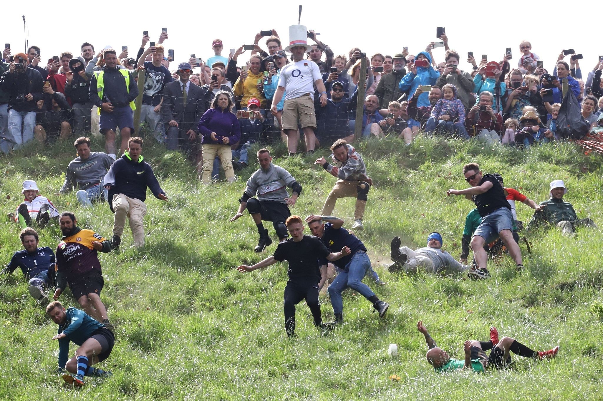 Race start. Coopers Hill Cheese Rolling Race. 29-May-2023. Race downhill. Gloucestershire tradition.