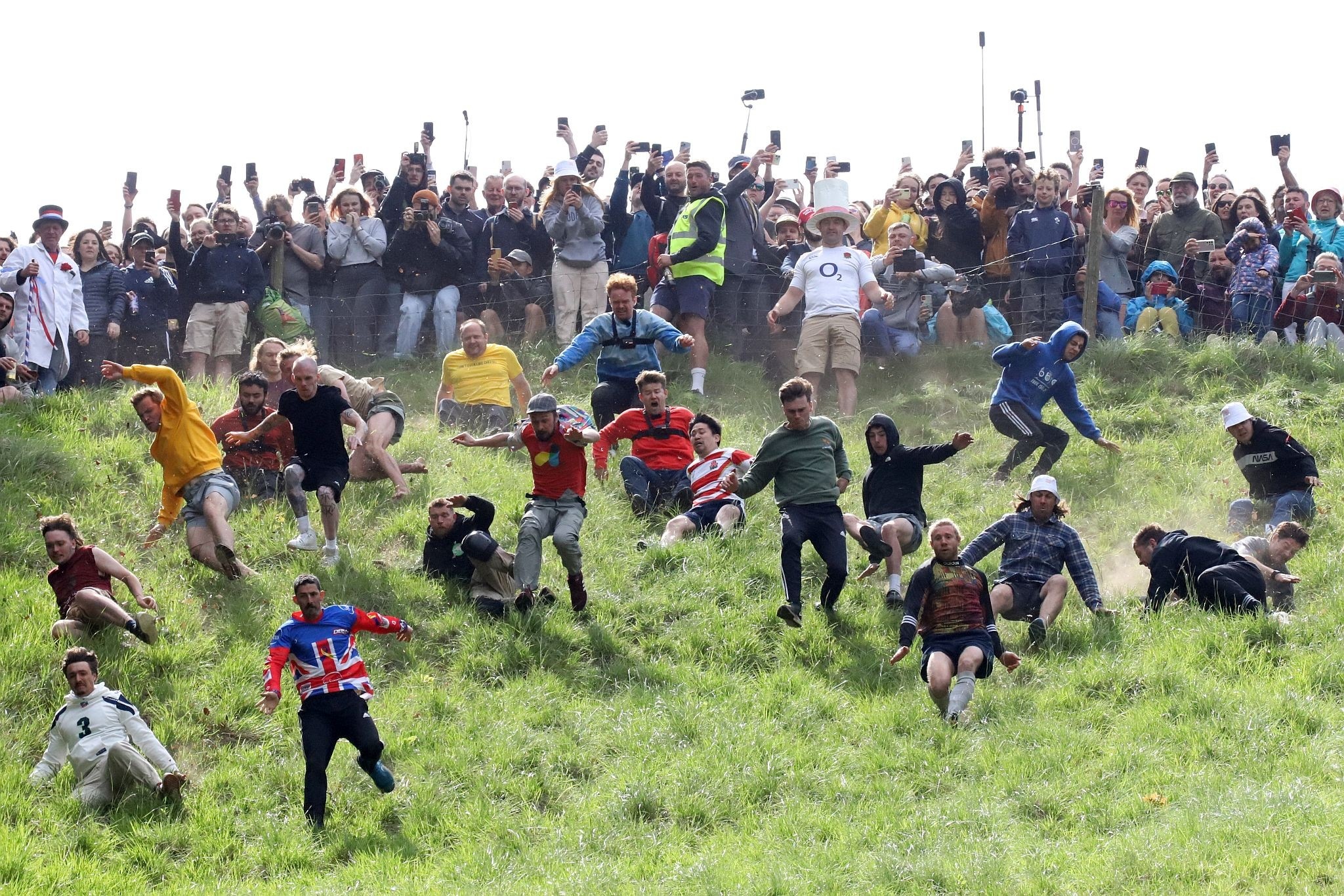 The start of a race. Coopers Hill Cheese Rolling Race. 29-May-2023. Race downhill. Gloucestershire tradition.
