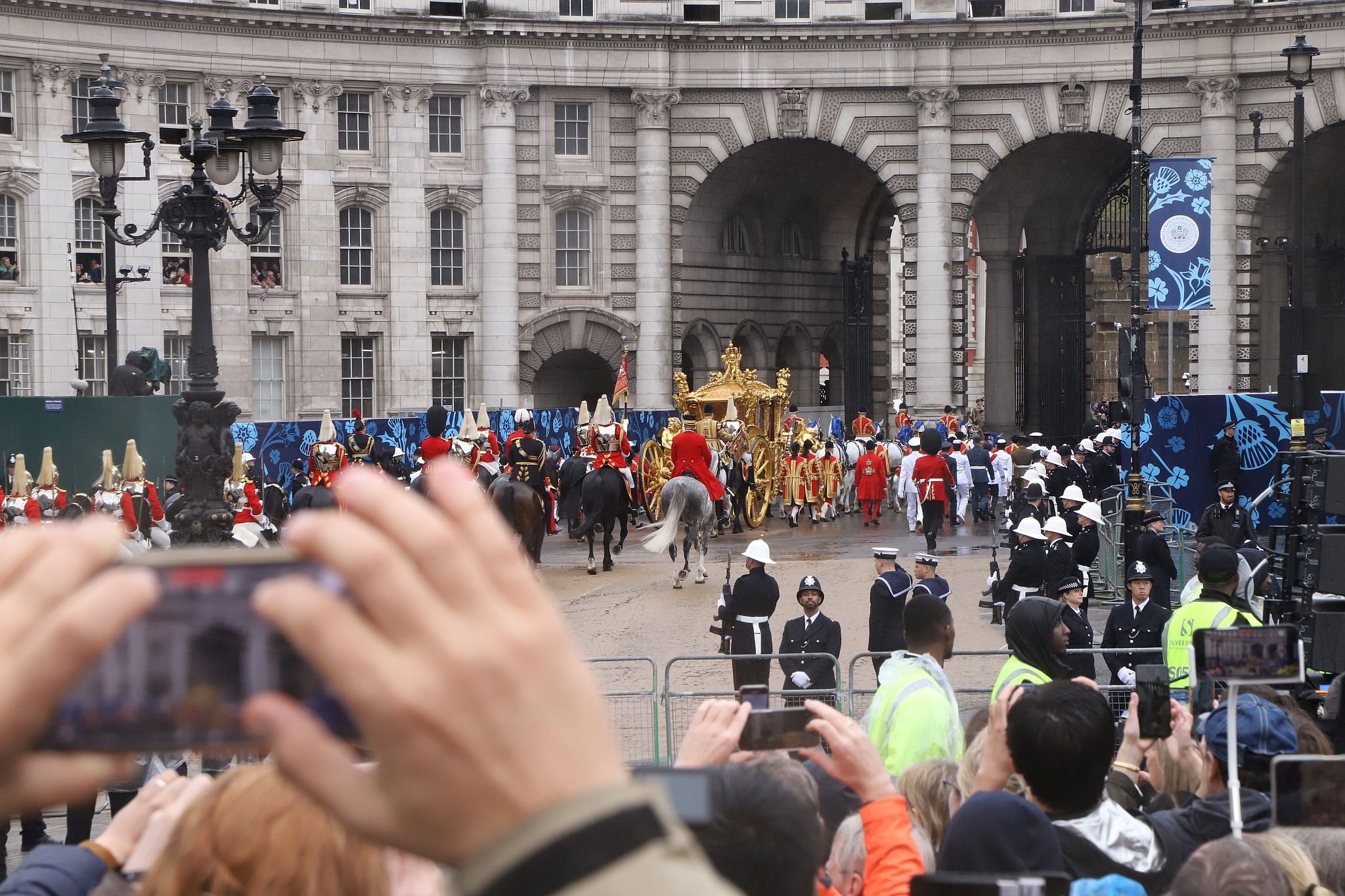 Returning from the Coronation Service at Westminster Abbey, The Gold State Coach carrying King Charles and Queen Camilla is about to pass through Admiralty Arch on the return procession back to Buckingham Palace. 06-May-2023.