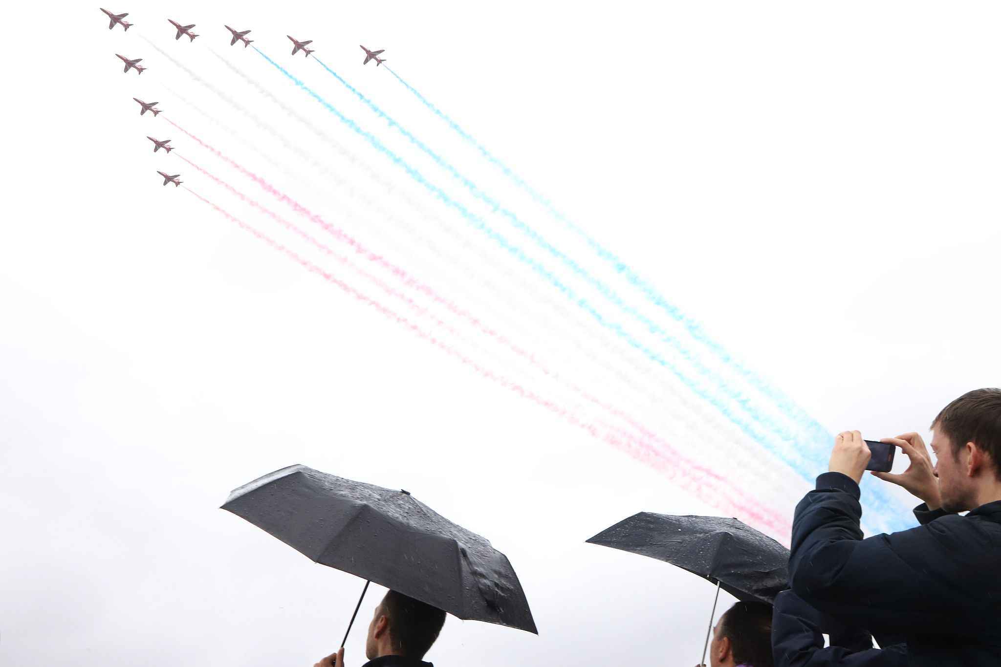 Big state occasions always call on the Royal Air Force to stage a fly past. After a lot of planning, the weather forecast earlier in the week started to predict heavy rain for the day of the Coronation. The weather lifted just enough for some of the aircraft to take part. This picture was taken from Waterloo Bridge. The RAF Red Arrows always conclude the display trailing their red, white and blue smoke. 06-May-2023.