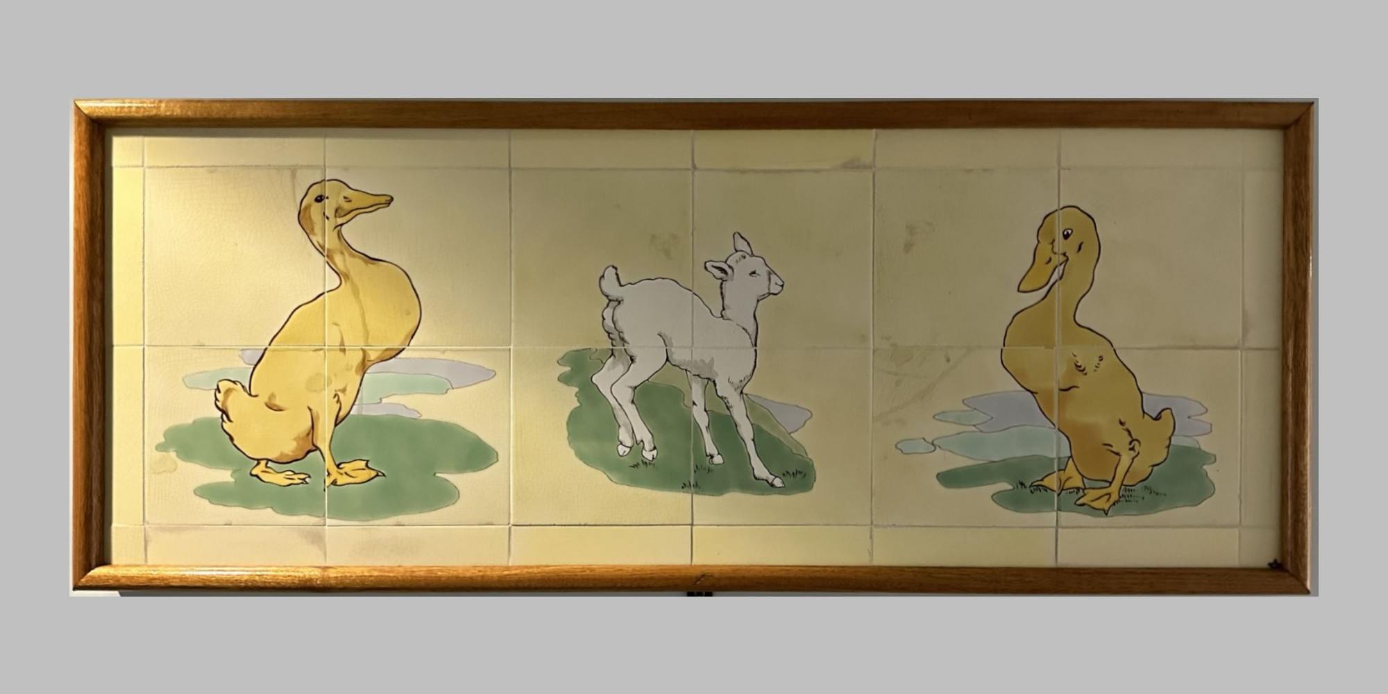 Animal scenes painted on Doulton tiles from the Evelina Children's Hospital displayed in a corridor of St Thomas' hospital.