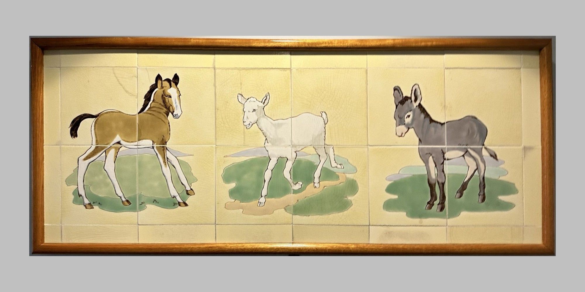 Animal scenes painted on Doulton tiles from the Evelina Children's Hospital displayed in a corridor of St Thomas' hospital.
