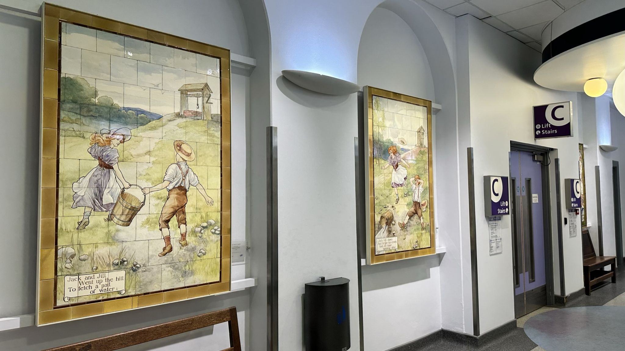 Nursery rhyme fairy tale scenes painted on Doulton tiles from the Evelina Children's Hospital displayed in the long corridor of St Thomas' hospital.