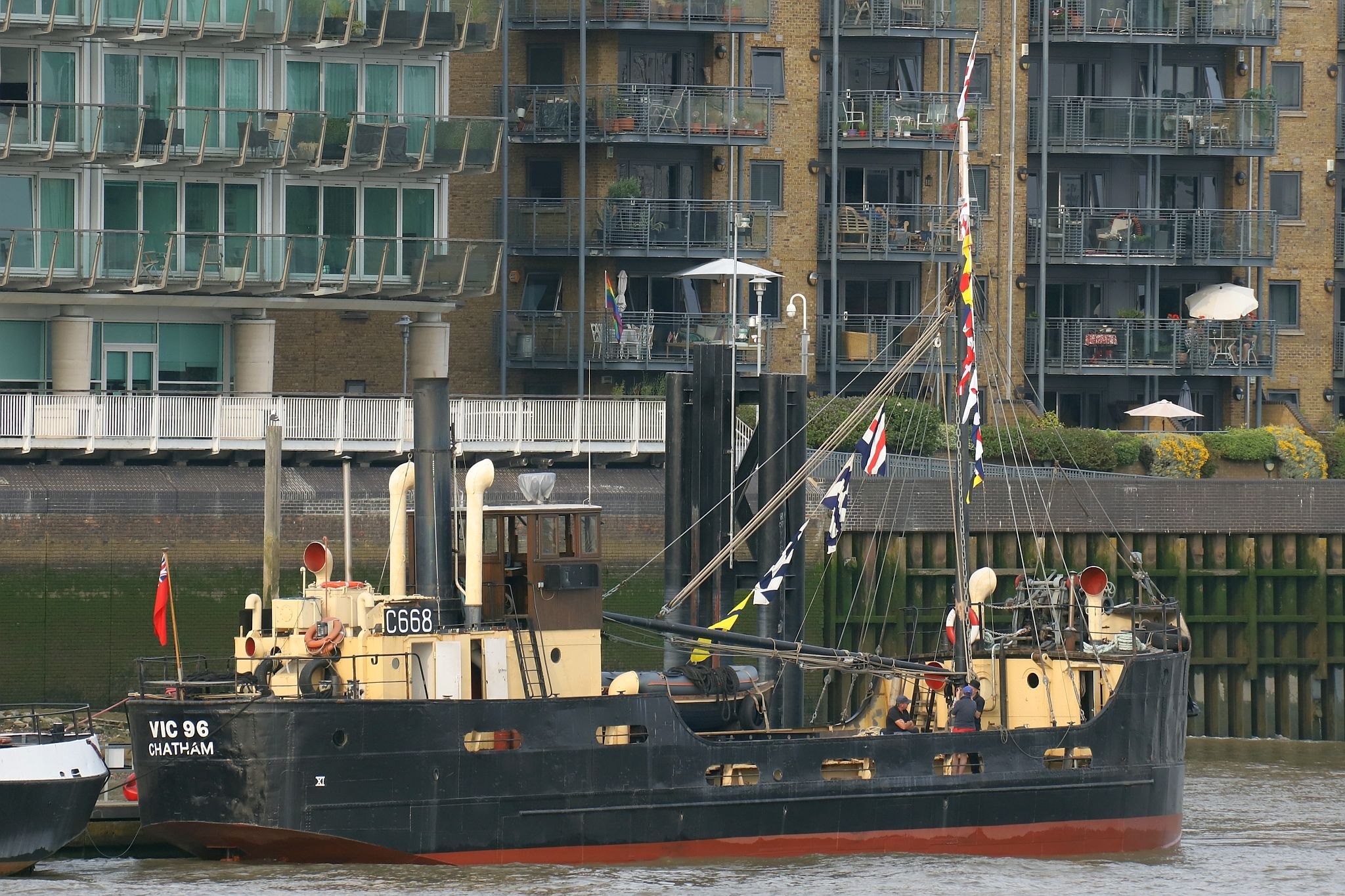 VIC 96 tied up alongside Hermitage Moorings in central London by Tower Bridge. Steam powered ship VIC 96 visited central London in June 2023.