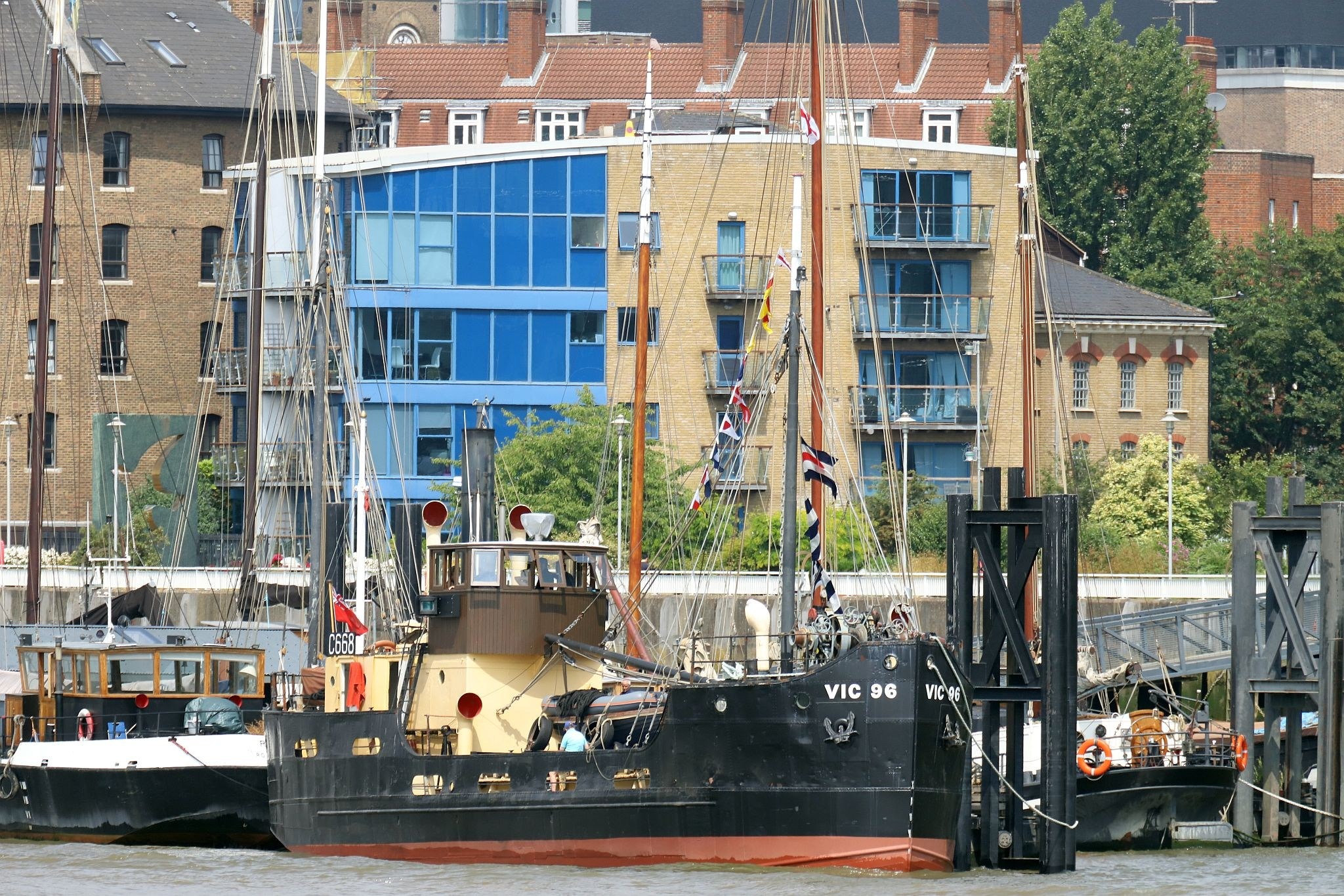VIC 96 tied up alongside Hermitage Moorings in central London by Tower Bridge. Steam powered ship VIC 96 visited central London in June 2023.