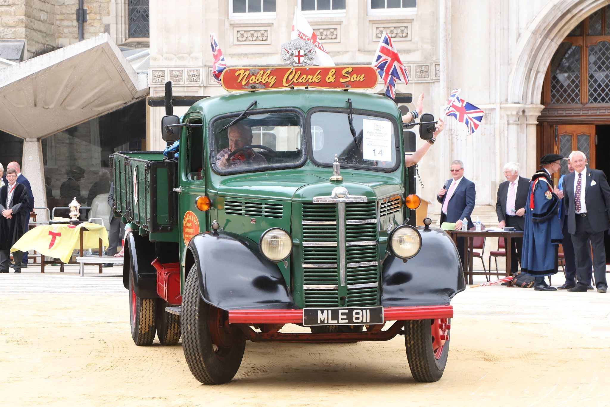 Bedford M Type 1953, MLE811. City of London 2023 Cart Marking in Guildhall Yard on 22-Jul-2023. Hosted by the Worshipful Company of Carmen with the Lord Mayor of the City of London in attendance. Wooden plates on the vehicles are branded with hot irons to allow them to ply for trade in the Square Mile. Another of the City Livery Company's annual ceremonies.