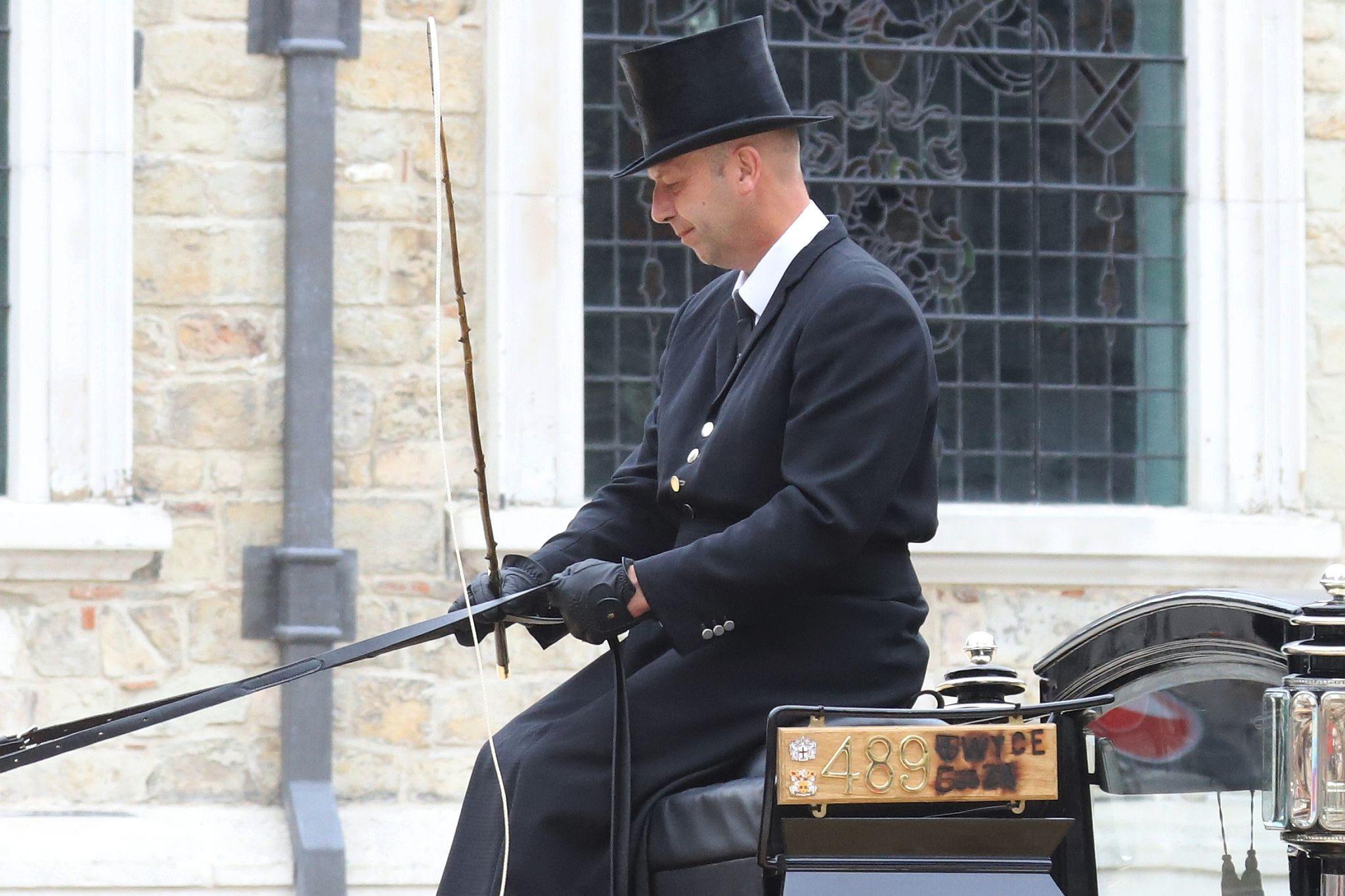 Horse Drawn Marsden Mourning Coach 1890 showing its newly branded registration plate. City of London 2023 Cart Marking in Guildhall Yard on 22-Jul-2023. Hosted by the Worshipful Company of Carmen with the Lord Mayor of the City of London in attendance. Wooden plates on the vehicles are branded with hot irons to allow them to ply for trade in the Square Mile. Another of the City Livery Company's annual ceremonies.