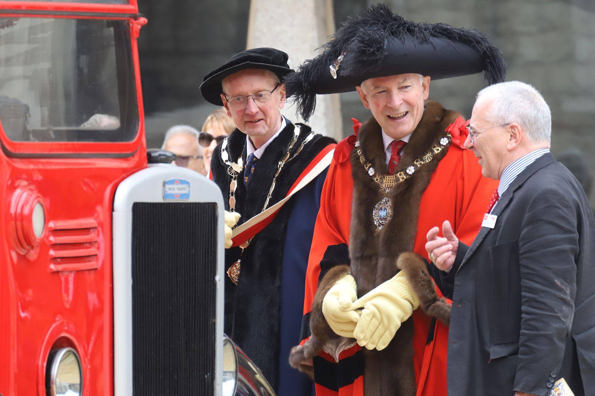 Lord Mayor (Nicholas Lyons) and the Master Carman (Andrew Turner) chat to an exhibitor. Leyland Titan 1950 LLU957. City of London 2023 Cart Marking in Guildhall Yard on 22-Jul-2023. Hosted by the Worshipful Company of Carmen with the Lord Mayor of the City of London in attendance. Wooden plates on the vehicles are branded with hot irons to allow them to ply for trade in the Square Mile. Another of the City Livery Company's annual ceremonies.