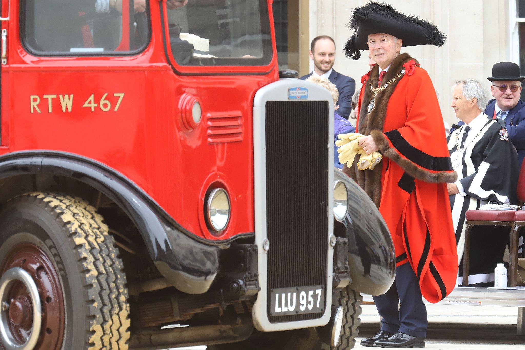 Lord Mayor (Nicholas Lyons) admires an exhibit. Leyland Titan 1950 LLU957. City of London 2023 Cart Marking in Guildhall Yard on 22-Jul-2023. Hosted by the Worshipful Company of Carmen with the Lord Mayor of the City of London in attendance. Wooden plates on the vehicles are branded with hot irons to allow them to ply for trade in the Square Mile. Another of the City Livery Company's annual ceremonies.