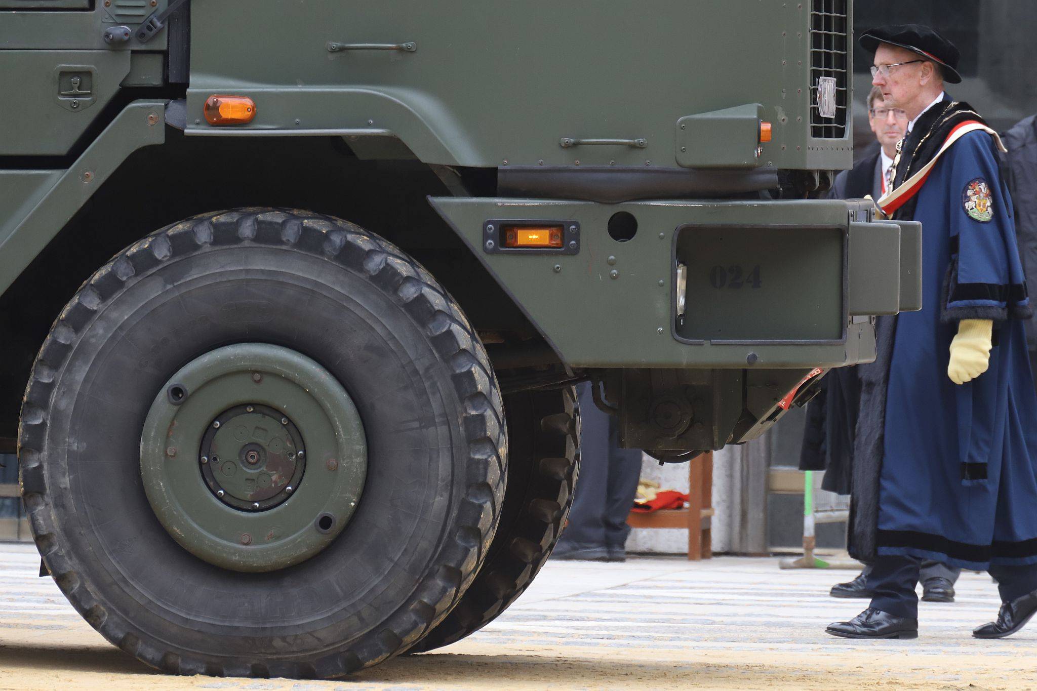 Master Carman, Andrew Turner, walking to brand an exhibit. City of London 2023 Cart Marking in Guildhall Yard on 22-Jul-2023. Hosted by the Worshipful Company of Carmen with the Lord Mayor of the City of London in attendance. Wooden plates on the vehicles are branded with hot irons to allow them to ply for trade in the Square Mile. Another of the City Livery Company's annual ceremonies.