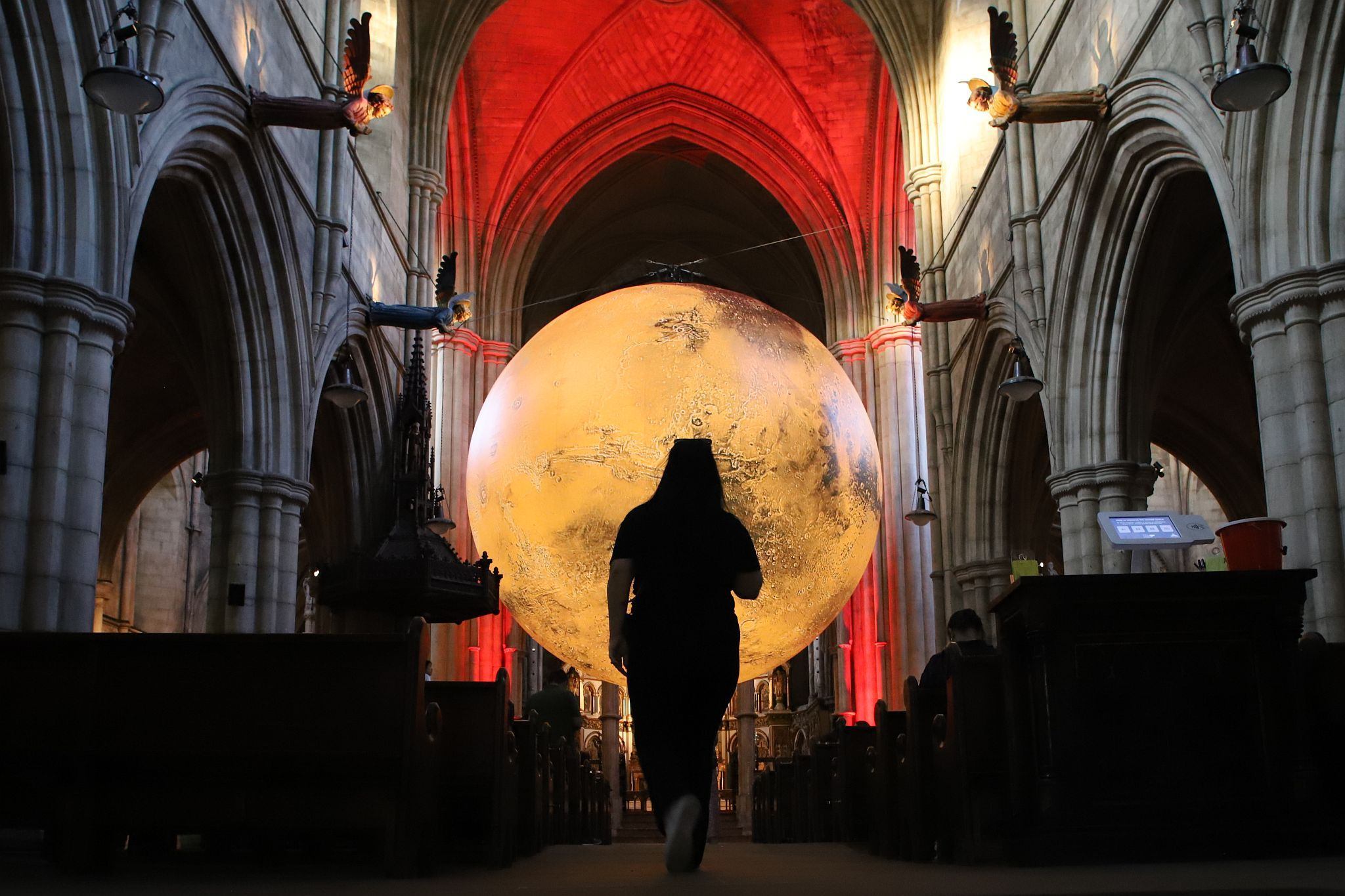 Luke Jerram's "Mars: War & Peace" hosted by the Kensington and Chelsea Festival at St John the Baptist Church in Holland Road, West London.